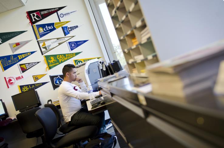 A student on a computer in the University Transfer Center